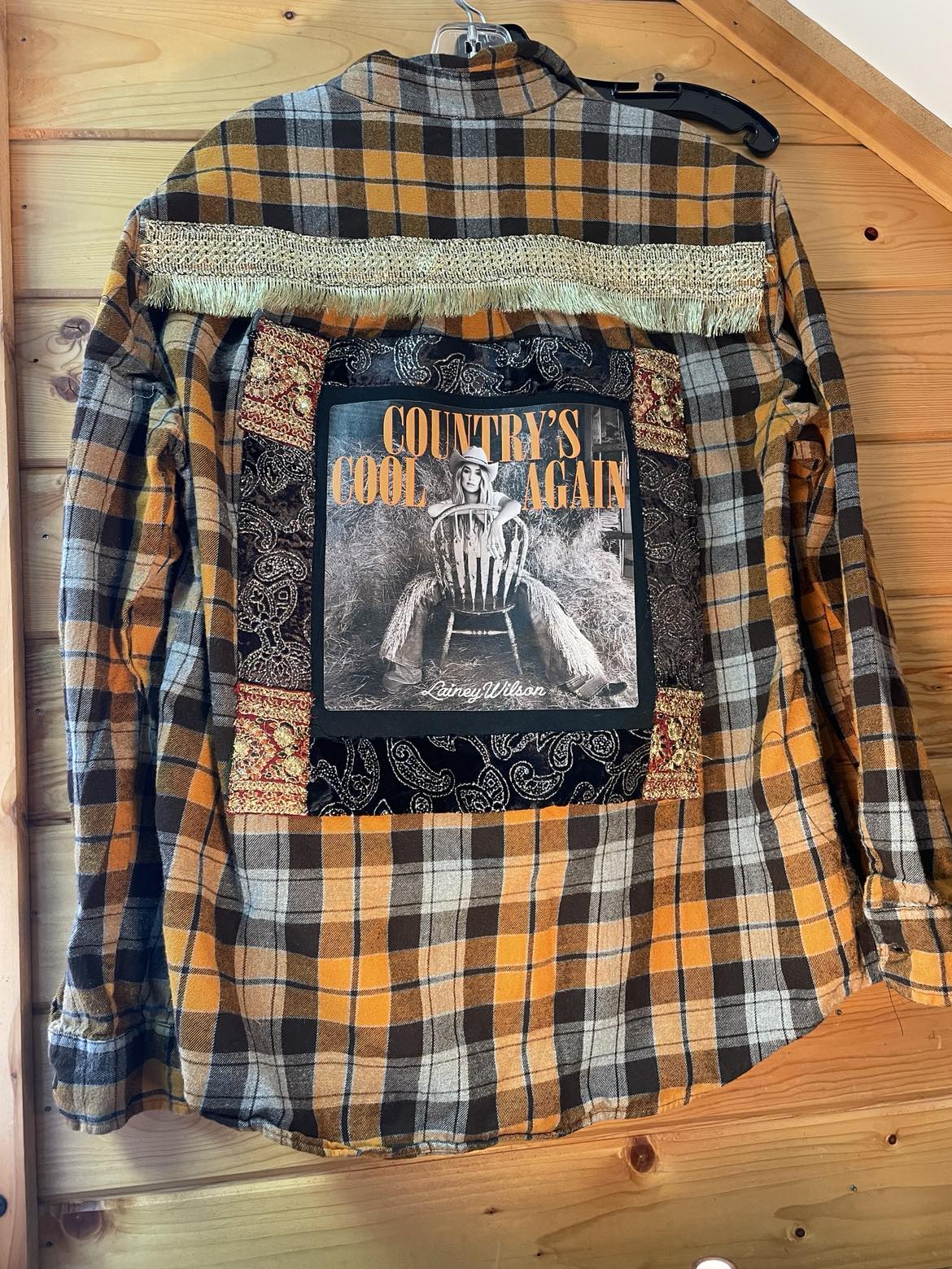 Country’s Cool Again – Lainey Wilson Gold Fringe Flannel