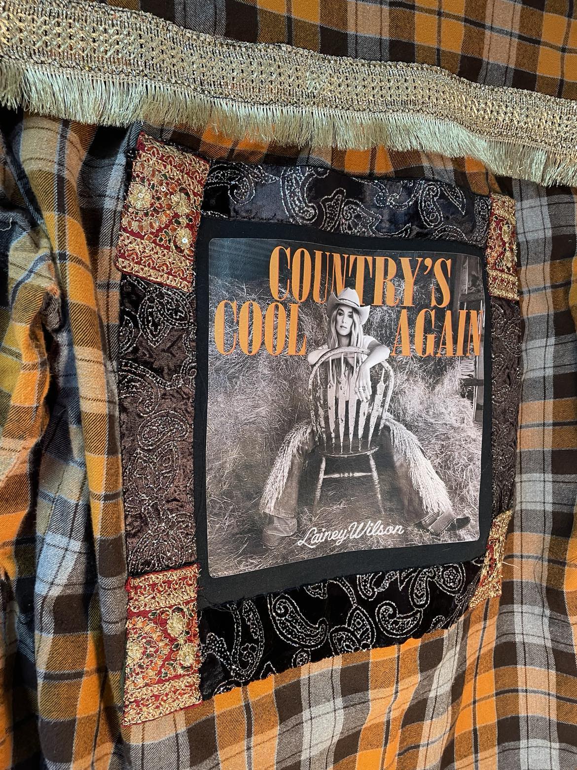Country’s Cool Again – Lainey Wilson Gold Fringe Flannel