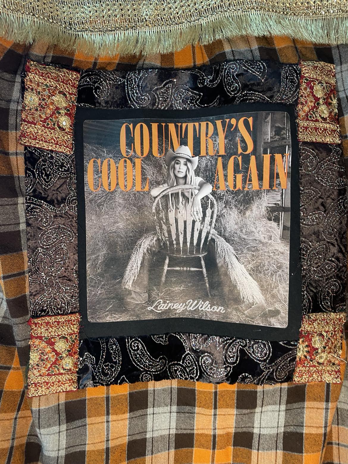 Country’s Cool Again – Lainey Wilson Gold Fringe Flannel