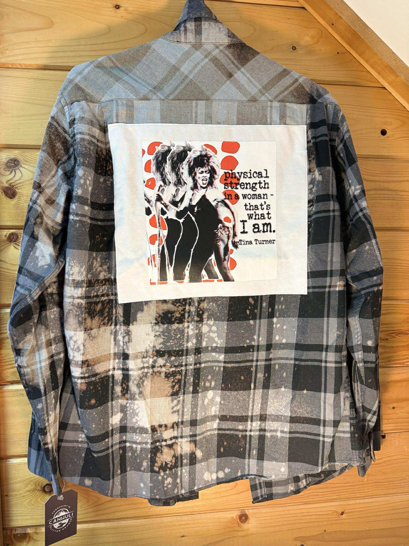 Tina Turner in black plaid “Physical Strength” Flannel