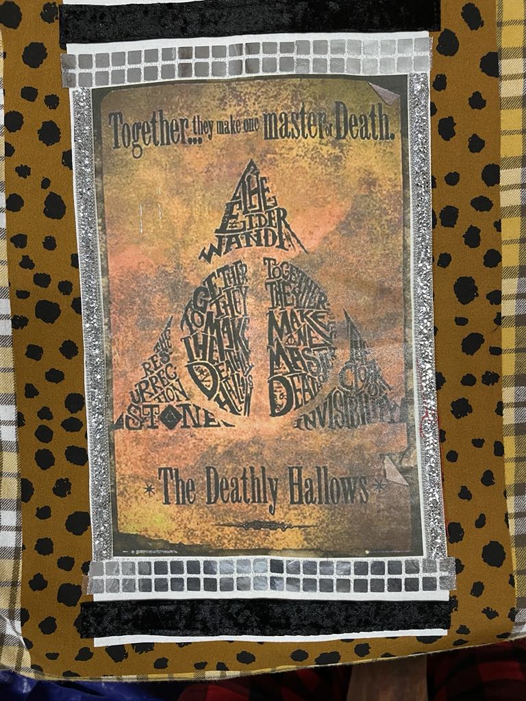 Harry's shirt - the deathly hallows