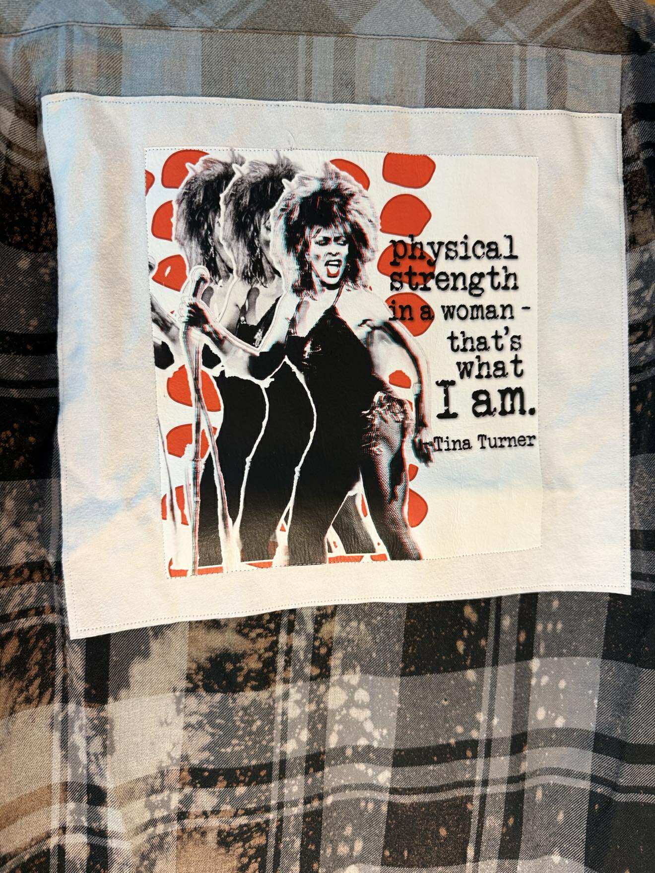 Tina Turner in black plaid “Physical Strength” Flannel