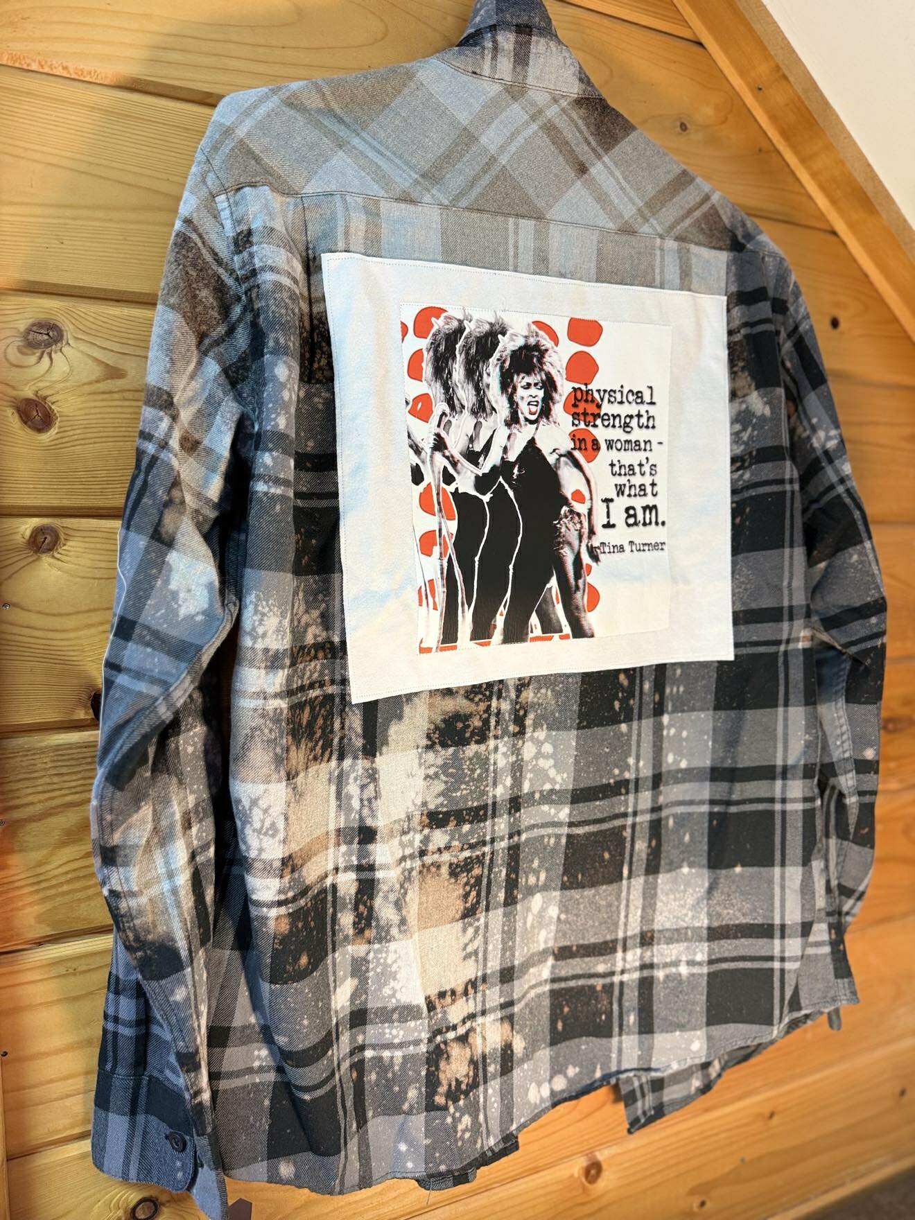 Tina Turner in black plaid “Physical Strength” Flannel